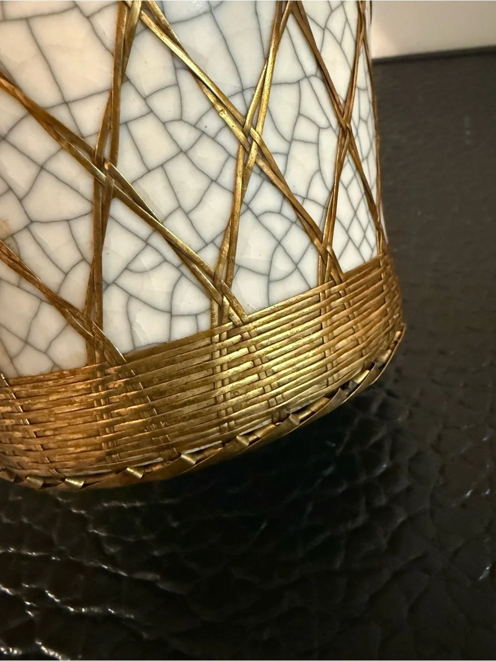 Japanese pottery vase craquelure glaze and a basketweave metal overlay.